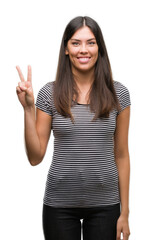 Obraz premium Young beautiful hispanic woman showing and pointing up with fingers number two while smiling confident and happy.