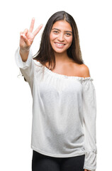 Young beautiful arab woman over isolated background smiling with happy face winking at the camera doing victory sign. Number two.