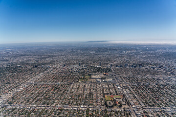 aerial landscape view of greater Los Angeles area with Fairfax district in front, located in Central Los Angeles area and south part of LA in the background