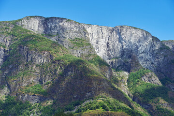 Shadows playing on a mountain by the Naeroeyfjorden Fjord by Undredal, Western Norway.
