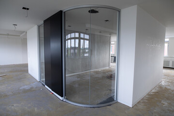 Empty Office Space with Curved Glass Walls