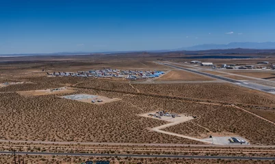 Selbstklebende Fototapeten Cappuccino Mojave, aerial landscape view of landscape around airplane storage area at Mojave Air and Space Port at Rutan Field with many retired passenger and cargo aircrafts stored on desert sand    © Mario Hagen