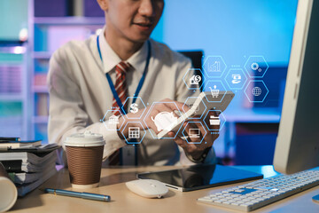 Business man using digital tablet analyzes business data, busy working on laptop computer with smart phone and business report on office desk, business strategy analysis concept.