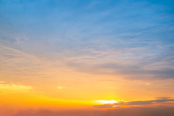 Obraz premium Beautiful , luxury soft gradient orange gold clouds and sunlight on the blue sky perfect for the background, take in everning,Twilight, Large size, high definition landscape photo