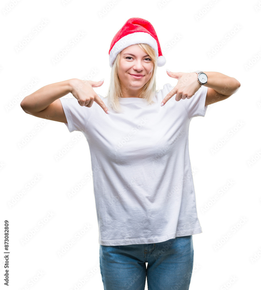 Poster young beautiful blonde woman wearing christmas hat over isolated background looking confident with s