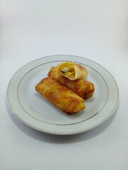 Risoles: Popular Indonesian Snack with Chicken, Carrots, Onion, Potato, and Green Onion Filling, Wrapped in Thin Wrapper, Covered with Bread Crumbs, Deep-Fried on White Background