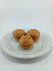 Kue Apem: Indonesian Steamed Sweet Dessert with White Brown Sugar or White Sugar, Showcasing Traditional Culinary Heritage on a Clean White Background