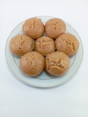 Kue Apem: Indonesian Steamed Sweet Dessert with White Brown Sugar or White Sugar, Showcasing Traditional Culinary Heritage on a Clean White Background