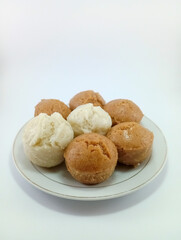 Kue Apem: Indonesian Steamed Sweet Dessert with White Brown Sugar or White Sugar, Showcasing Traditional Culinary Heritage on a Clean White Background