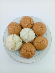 Kue Apem: Indonesian Steamed Sweet Dessert with White Brown Sugar or White Sugar, Showcasing Traditional Culinary Heritage on a Clean White Background