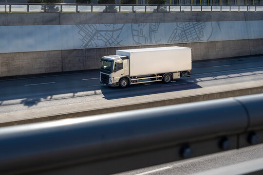 High angle view of truck moving on highway during sunny day