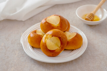 Pretzel buns on white plate