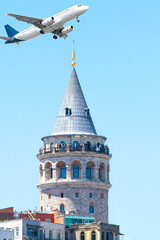 Galata tower and passenger plane on blue sky background. Aviation idea concept.	