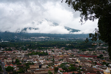 Cloudy view of Volcan Acatenango with Antigua Guatemala underneath