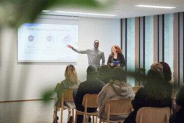 Multiracial business people giving presentation during meeting in office