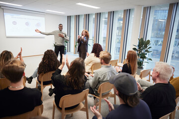 Businessman sharing ideas with colleagues during meeting in office