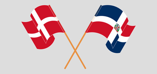 Crossed and waving flags of Denmark and Dominican Republic