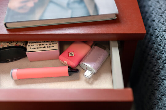 Close-up of objects in open drawer
