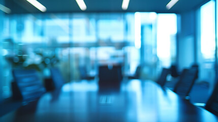 A blurred modern business office interior room suitable as a background for business concepts, such as meeting rooms and corporate offices. The blur effect creates a light blue background in a modern
