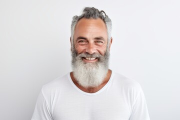 Obraz premium Smiling bearded mature man portrait against white background