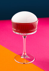 Drink on a vibrant pinkorange background. Exotic drink.