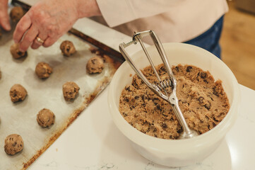 Scooping Chocolate Chip Cookie Dough in the Kitchen