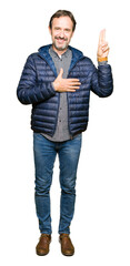 Middle age handsome man wearing winter coat Swearing with hand on chest and fingers, making a...