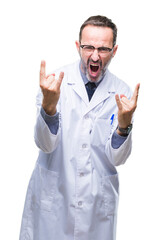 Naklejka premium Middle age senior hoary professional man wearing white coat over isolated background shouting with crazy expression doing rock symbol with hands up. Music star. Heavy concept.
