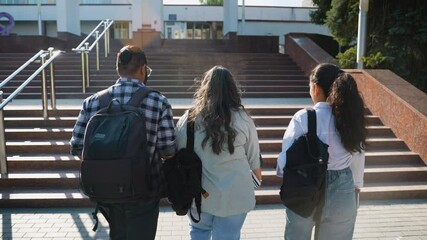 Indian students going to class, rear view - Powered by Adobe