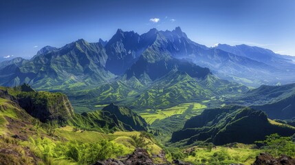 Obraz premium A breathtaking view of a mountain range with sharp peaks and lush green valleys, under a clear, blue sky.