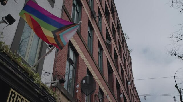 The rainbow LGBTQ flag and attributes on Canal Street, in the Gay Village of Manchester, UK.