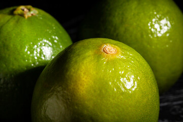 lime on black wood background