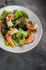 shrimp salad prawns or langoustines green leaf lettuce mix fresh meal food snack on the table copy space food background rustic top view