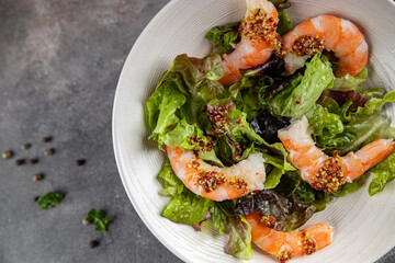 shrimp salad prawns or langoustines green leaf lettuce mix fresh meal food snack on the table copy space food background rustic top view