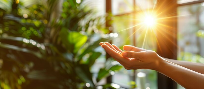 Open hand with rays of light radiating from,healing and spiritual energy on indoor background.
