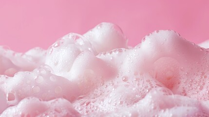 Fototapeta premium Pink background with soap foam and empty space