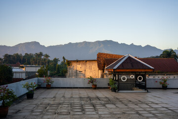 Hotel Rooftop in Borobudur, Magelang, Indonesia - sunrise dawn warm light, roof top with access and plantpots.