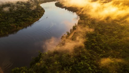 Fotobehang Zwart Evapotranspiration of the forests surrounded by the Nanay River, landscapes of the Nanay River, provide fresh water and biodiversity in its surroundings, it is a river within the Amazon rainforests  © Gino Tuesta