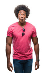 Afro american man over isolated background making fish face with lips, crazy and comical gesture. Funny expression.