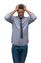 Fototapeta premium Young african american business man over isolated background suffering from headache desperate and stressed because pain and migraine. Hands on head.