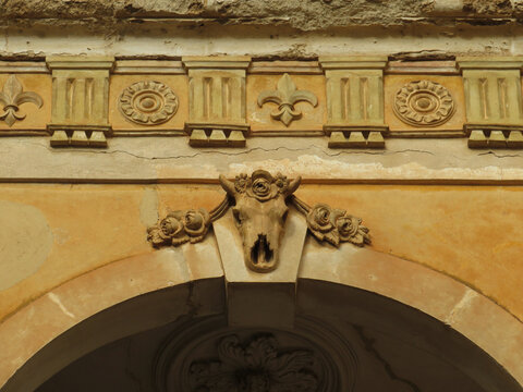 Historic architecture in the town of Manacor. Detail of keystone with skull and classic cornice. Mallorca Island. Spain.