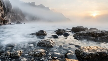 Obraz premium the fog covers the water and cliffs covered with rocks,