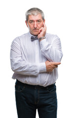 Handsome senior man wearing bow tie over isolated background thinking looking tired and bored with depression problems with crossed arms.