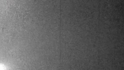 Black and white noisy, grainy television screen texture. Abstract scanned tv style film. Noise gray background. Vintage archive pattern. Retro 4k footage. Real grain monitor. Scanned overlay effect