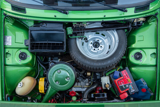Under the hood of restored 1985 Zastava 101 (Yugo Skala 55) licensed Yugoslavian FIAT 128. Spare wheel is under the hood - old dangerous design dangerous for the driver. Subotica, Serbia  29.06.2024