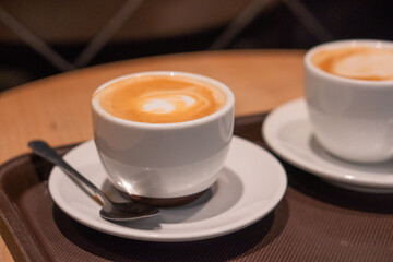 Indulging in coffee and pastries at a cozy cafe