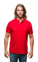 Obraz premium Young handsome man with long hair over isolated background with serious expression on face. Simple and natural looking at the camera.