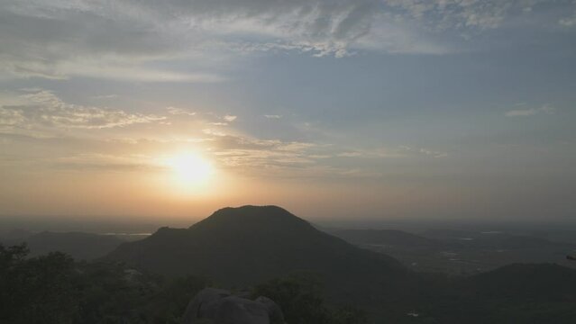 Time lapse sunset over The Barabar Hill Caves बराबर, are the oldest surviving rock-cut caves in India, dating from Maurya Empire some with Ashokan inscriptions, Makhdumpur, Jehanabad, gaya, Bihar
