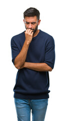 Adult hispanic man over isolated background looking stressed and nervous with hands on mouth biting...