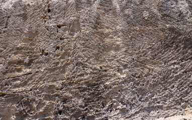 Stone wall. Rock texture. Brown gray grunge backdrop.